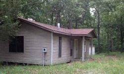 Mostly wooded Hunting & recreation Close to town Public water Partially finished cabin Excellent wooded acreage with southwest view perfect for building, hunting, camping & recreational fun. Beautiful creek runs along the back of the property. The small