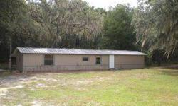 Remodeled mobile on two acre (double flag lot) backing up to florida greenway/horse trails. Ocala Marion County Association of Realtors is showing this 3 bedrooms property in Dunnellon.