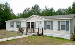 Well-kept manufactured home in very convenient location to all area amenities! Front deck, back deck, large fenced yard, woods offering privacy in back, large eat-in kitchen, lovely fireplace, split-bedroom plan, huge walk-in closet in master with access