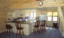 A HAYES LAKE STATE FOREST OASIS! Great opportunity to own a secluded cabin surrounded by thousands of acres of State Land. The property features an open floor plan, vaulted ceilings, updated kitchen with a spacious loft. Great place for snowmobiling,