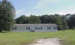 Big, spacious 30x76 4BR/2BA 2005-year Manufactured Home, with plenty of extras, on an open 1.58-acre tract at the deed-restricted Oak Meadows S/D. Has over-sized living & family rooms (stone fireplace in family room), plenty of cabinet/counter space in