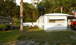 A retirement park with a community spirit ? ? Very Clean (12' x 60'), 2 Bedrooms 1 bathroom, (bathroom has been remodeled) screened enclosed Florida room, light paneling, wall, a/c unit. All window dressings stay and partially furnished, if wanted?Comes