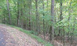 Beautifully wood and gently down-sloping lot that would be a great building site for a home with a walk-out basement. Listing originally posted at http