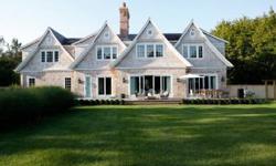 Poised on an immaculately landscaped acre, this custom built traditional is located in one of the best locations in the Hamptons. Bridgehampton South, moments from some of the best ocean beaches in the world. The 8,000 sf residence features an interior
