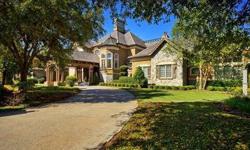 Pleasant golf course and lake views surround this two-story gated French Country-style estate featuring five bedrooms, six full and two half baths. A grand porte-cochere and motor court and finely manicured grounds with waterfalls, walking paths and a