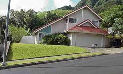 Excellent Kaneohe location! Large 3/2.5 home tucked up against lush conservation area. Located at end of quiet dead end road. Large front & back yards. Excellent views of the Koolaus & Kualoa Ridge. Features open kitchen, large 'great room', & many