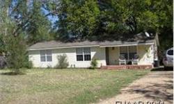 Beautifully update 2/1 home on half an acre.Covered front porch welcomes you into this pretty home.Great laminet floors in main living areas. Large kitchen has plenty of cabinet space and beautiful dinning room. Extra room would make a great office space.