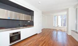 WebID 47878
The undeniable yellow accents set it apart
from all of its neighbors in FiDi. The building is 47 stories and comprising.
South East exposure soaking the apartment with tons of sunlight!
Concealed custom kitchen all appliances are faced with