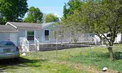 #1685R-Lovely home on the riverfront! This 1997 manufactured home has 3 BR, 2 BA and three attached garages and a carport, too! Open floor plan with kitchen/dining combo. Plenty of room for all your laketoys and just a short distance to all conveniences.