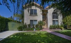 Gated Mediterranean 4BR+3BA home in prime Tarzana location South of Blvd. Spacious living room has dramatic 2 story high ceiling, gorgeous wood floors, fireplace, large windows. Gourmet family kitchen w/opens to formal dining. Large walk in closet and