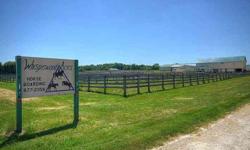 Great opportunity for the horse enthusiast with residence, (3) barns and indoor/outdoor arenas. The main barn has 20 stalls and an 80x200 indoor arena. The outdoor arena measures 300x150 and two additional barns offer 34 more stalls as well as 2 tack