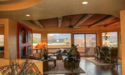 Stunning custom built Santa Fe home in the stylish and classy Casa Contenta gated subdivision in West Sedona. Elegance, style and quality designer finishes are evident throughout this beautiful home. Upon entering you're struck by spectacular red rock