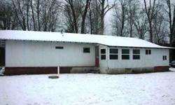 The property is a uniquely-constructed joining of two mobile homes to form one nice ranch home with a 40x40 garage/pole building that is insulated and heated, has electric, an office, a workshop and a 14ft high garage door with regular garage door. The