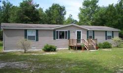 Upgraded 1999 doublewide on paved CR 138 sitting on 11.33 acres. Home features a split floor plan, new laminent floors, large master bath with separate tub and shower. Lots of closets. Enjoy the wildlife from your back porch. Home is close to both the