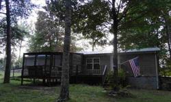 Priced to sale four bedroom two bath modular home with screened porch. Fenced and cross fenced 24x67 building suitable for RV and cars. Being sold with dishwasher that doesn't currently work. Loads of wildlife deer and turkey. Underpinned with concrete