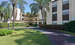 Very well-maintained end unit with view of golf course and pool. Wood floors, shutters, screened lanai, extra storage and covered parking. Excellent community near downtown Naples.Listing originally posted at http