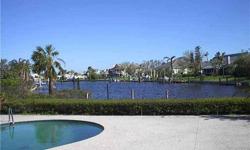 Waterfront pool home with boat dock. Two master suites - original and addition. Newer stainless refrigerator, range, dishwasher, microwave 2007. Newer front-load washer and dryer 2007. New roof in 2004. New AC units in 2004. The Moorings community offers