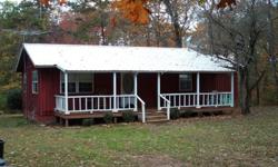 1,000's of Acres of Ozark National Forest out the front door. 3 bedroom 1 bath home approx 1,100 sqft with 8.6 acres, m/l. Two year old metal roof, new kitchen cabinets and bathroom vanity, new Bosch dishwasher, energy efficient windows, screened in back