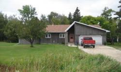 WARROAD HOME WITH DOUBLE GARAGES! Come take a look at this 2 bedroom 2 bath home South of Warroad near the Warroad River. Store your vehicles and still have room for extras. Large basement with plenty of room for expansion and setup for an additional