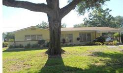 This vintage masonry 2 bedroom, 1 bath Jungle Gem lives large and makes for a perfect starter - second or retirement home. Eat-in Kitchen, Formal Living Room and Florida Room. Attached 1 car Carport with storage and Washer. Beautiful Mature Oak in the Fro