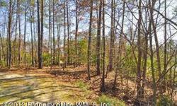 Picturesque, gently elevated, partially wooded and overlooking the 14th tee of the georgeous Traditions Golf Course! This is a beautiful lot that's just begging for your dream home!Listing originally posted at http