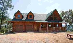 Exceptional construction is evident throughout this newly constructed custom 4000 square foot full log home. There is a 1175 square foot great room with a 25 foot cathedral ceiling, massive fireplace and many custom log interior treatments. High on a