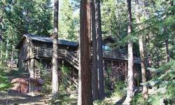 Spacious Tahoe log home on large, landscaped lot with beautiful trees. Main level has wrap around deck off kitchen, dining, and den/office, an expansive living room with wood burning stove, plus three bedrooms and two baths, including the master suite.