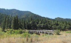 This amazing 165' long bridge gives you access to 138+ acres of fenced and cross-fenced pasture land, timber and privacy. Listing originally posted at http