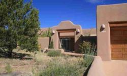 Custom built Las Barrancas beauty being offered for the first time! Situated on the high ridge of the area, this single level home has great Jemez mountain and sunset views. Enjoy the summer evenings from the enormous and impressive deep portal with built