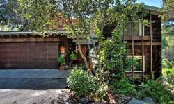 Nature lovers paradise, this sun drenched home is close to town & BART. Wood paneling, raised beam ceilings, sky lights & walls of glass. Large family room. Updated kitchen w/ skylight in breakfast nook. Shaded patio & decks for enjoying the outdoors.