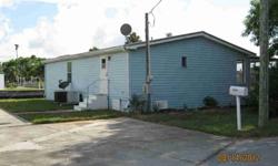 Great Deal for 3/2 waterfront property with Gulf Access! Large covered screened patio overlooking the water with extra parking area for RV or boat. This double wide mobile home is at the end of a quiet cul de sac with extra storage shed outside. Needs a