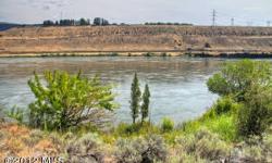 Call of the wild...top Walleye & Sturgeon fishing area, wildlife & indigenous natural habitat on over 3 acres, FERC high water mark boardered land to the Columbia River. You'll enjoy the undisturbed landscaping, rock formations & changing seasons of