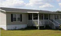 An unusual find in a manufactured home....smooth sheetrock walls. This home features a large custom built front porch for relaxing days and evenings in the country. This 3 bedroom 2 bath home has a split floor plan affording privacy for the master