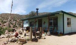 This very special property sits on 5 acres of desert tranquility! You'll get an amazing sense of peacefullness as you sit out on the covered porch of this charming cabin. Electric is solar and generator powered. Spacious studio style cabin with large