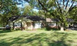 Just starting out or retiring--take a look at this home. Outside features very large, deep lot with pecan trees. Located in quiet country neighborhood in Glennville city limits. Within walking distance to shopping. Interior features include hardwood