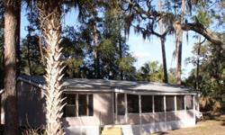 Florida Home For Sale By Owner - Located in Central Florida, Lake County, 2.67 acres with 3/2 roomy manufactured home, (1990) with living room cathedral ceiling, eat in kitchen, separate dining room, large front porch, master bedroom has bath with tub and