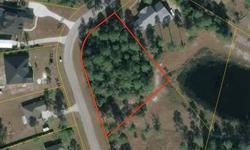 Lot 15 Cayman Circle - This large, interior corner lot is located in Nassau Lakes. Approximately .8 of an acre, this lot touches the lake and provides scenic lake views. Pick your own builder and there is no time requirement to build.Nassau Lakes is a