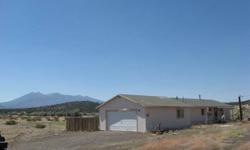 AFFORDABILITY! WoW! 2.5 acres with breathtaking views and located directly across from Forest Service. This 3 bdrm, 1 bath mobile is framed over and is on a stemwall offering additional living space and added insulation. Nice kitchen and bath. Large