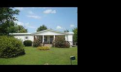 This really nice mobile home has a FR/Den addition with FP, partial basement & sun room, storm shelter, 36x42 detached garage with H&A. walk in closet in master, extra large kitchen, open floor plan, new laminate flooring, sitting on 3 +/- acres, close to