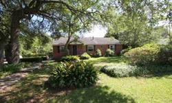 Real hardwood floors in all bedrooms, the rest is ceramic tile. Gas fireplace in den. Large kitchen. Beautiful large lot-huge Oaks, mature Magnolia and Pecan trees. Sidewalks all around this red brick home. Covered patio and shed-easily made into