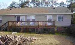 Spacious ranch style home just minutes from Holden Beach on double lot. Home in nice condition with oversized 2 car garage, fireplace, screened in front porch, large rear deck. This home is a SHORT SALE and all paperwork has been submitted to bank for