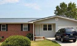 Totally remodeled brick & vinyl home. New beautiful hardwood floors, new carpet & tile. New kitchen cabinets & countertops, new doors & windows, new light fixtures, new metal roof, new vinyl siding, new heat/air system. ALL new! Very lg living room (room
