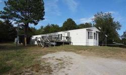 Looking for peace and quiet outside town? This is it. Two mobilehomes on 3.4 acres. One to live in and one to rent out and make the mortgage payment. Or maybe it's time to have Mom or Dad nearby - perfect solution. Both mobilehomes are in good shape.