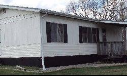 THIS MUST BE MOVED" I have a very nice Mobile Home, 2 bedroom, 2 bath, 36 x 24 comes with wooden porch. This was refurbished about 2 years ago. Kitchen has new quality oak kitchen cabinets. Floors are solid.The trailer comes with washer and dryer, stove,