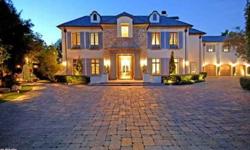 Prestigious French Country Estate in prime Toluca Lake built in 2007 and featuring every amenity. A world unto itself down a long private drive lined with Magnolia trees and gas lanterns this 10,000sqft jewel showcases the highest quality construction and