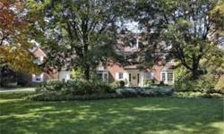 Prestigious Woodley Road with 1.5 acres. Pristine Red Brick Colonial renovated to perfection. French limestone floors thru-out most of the 1st flr. LR room overlooks bluestone terrace. Handsome library, FR w/fpl opens to sun rm. Custom kit w/sep breafast