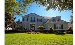 Stunning French Country style custom home, set on a tranquil pond located in the Gated, Golf community of Keene's Pointe. Meticulously maintained, open flowing floor plan with dramatic 21' ceilings offers 4 bedrooms, 4.5 baths, office, bonus room and a