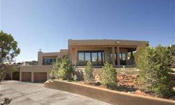This extraordinary custom hilltop home has views of the Sangre De Cristo Mountains and the Beautiful City Lights sparkle. Enjoy the convenience of being in-town, just minutes from the Santa Fe Plaza! There are 4 Bedrooms, 5 baths, and a separate theater