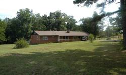 3 BEDROOM HOBBY FARM. This 1,456 sq. ft. ranch style brick home features a large living room w/wood burning fireplace, kitchen/dining combo with tile flooring, spacious bedrooms, 1 large bathroom, double carport w/storage above and chain link fenced back