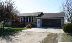 Small town living. Check out this 3 bedroom rambler. It features 2 bathrooms, a bright, cheery eat-in kitchen and a large basement familyroom. Add a large double attached garage and a large lot that is partially fenced and you have a place to call